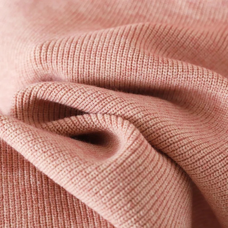"Elegant Turtleneck Sweater with Asymmetrical Cut and Tailored Trousers"