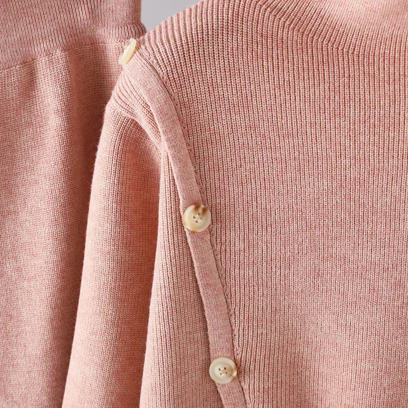 "Elegant Turtleneck Sweater with Asymmetrical Cut and Tailored Trousers"