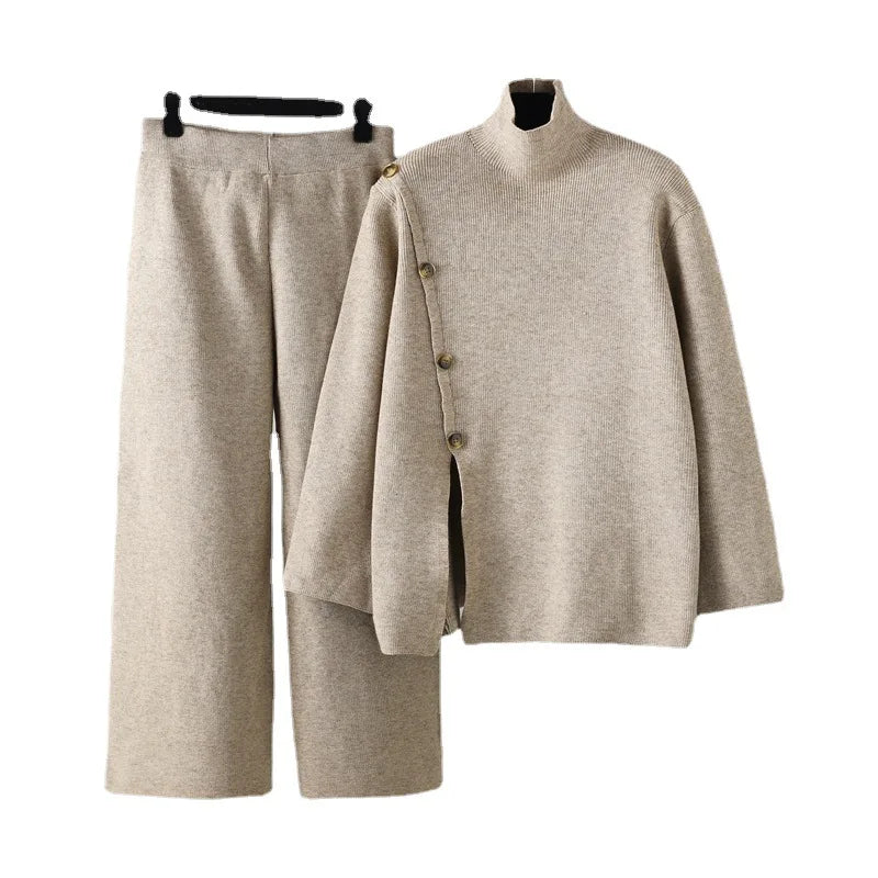 "Elegant Turtleneck Sweater with Asymmetrical Cut and Tailored Trousers"